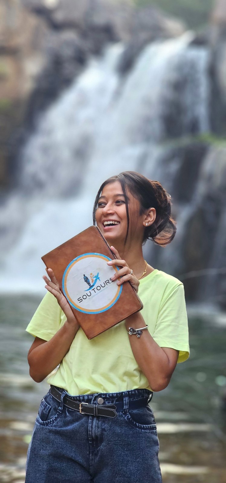SOU Tours team member with company folder
